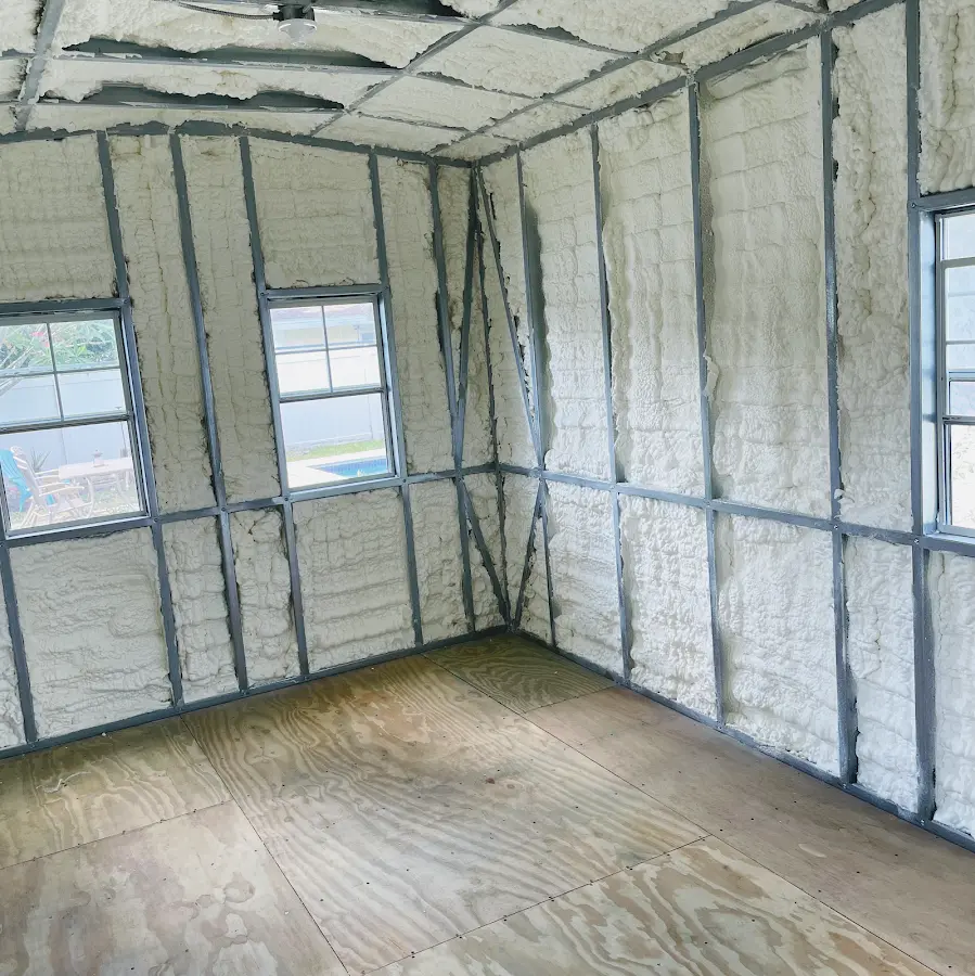 Closed-cell spray foam insulation applied to wall cavities in a residential project in Conewago